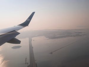 an airplane wing and a long bridge