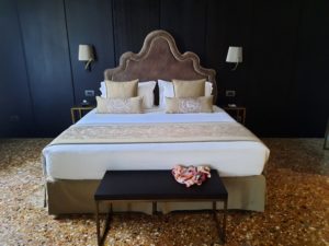 a bed with a brown headboard