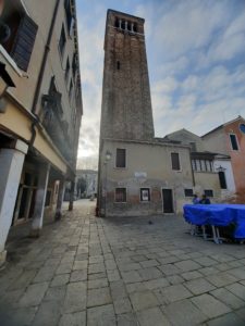 a tall tower in a courtyard