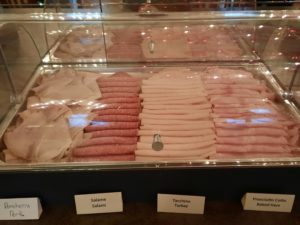 a display case with meats in it
