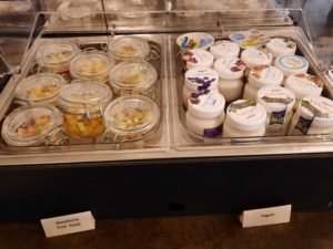 a display case with jars of food