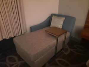 a couch with a small table