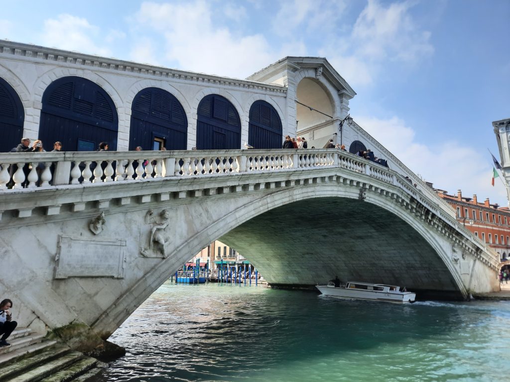 Rialto Bridge over water with people on it