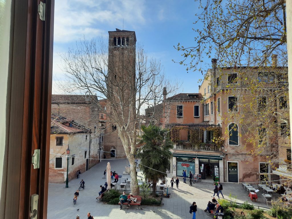 a courtyard with people and trees