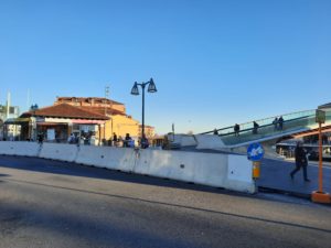 a walkway with a bridge over a road