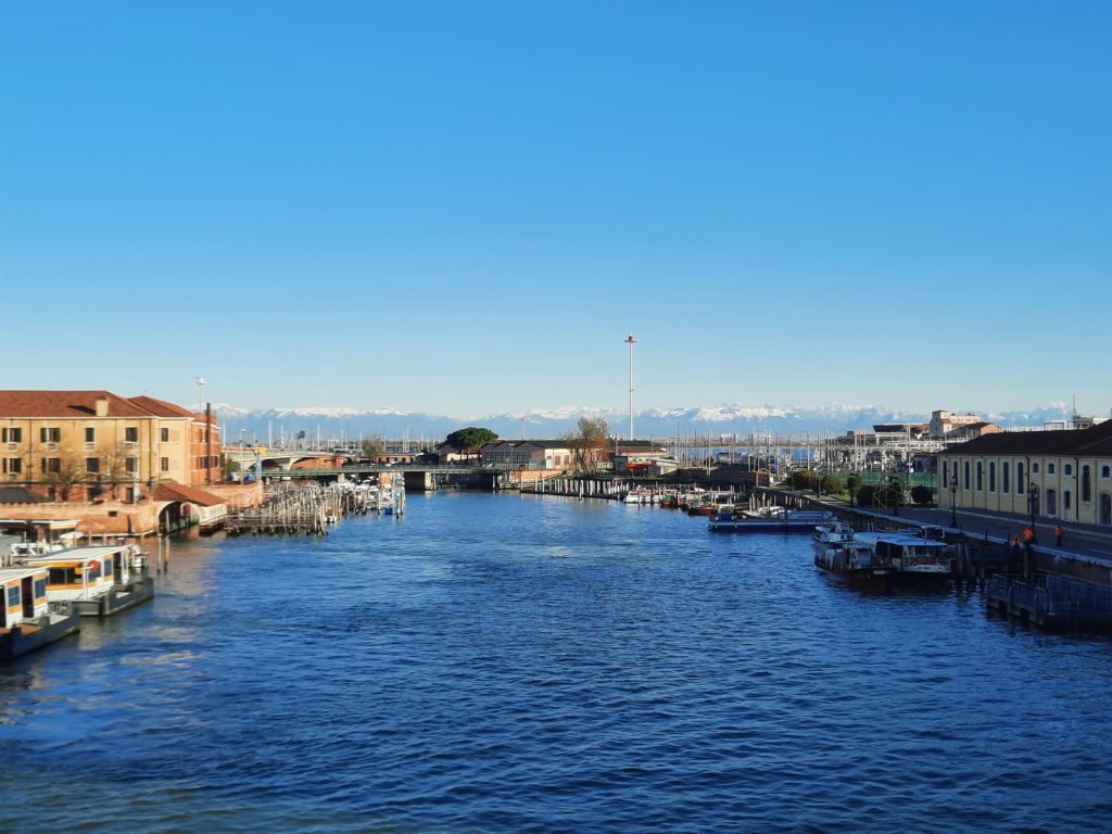 a body of water with buildings and boats