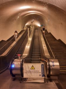 a escalator in a tunnel
