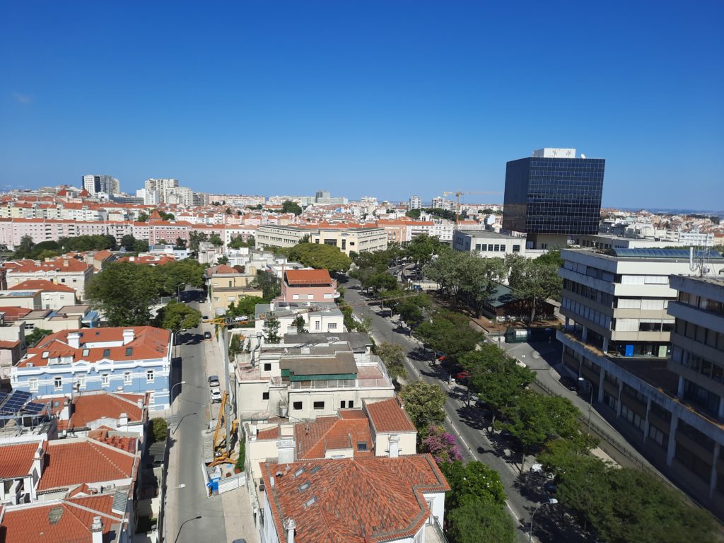 a city with many buildings and trees