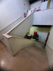 a staircase with a door open