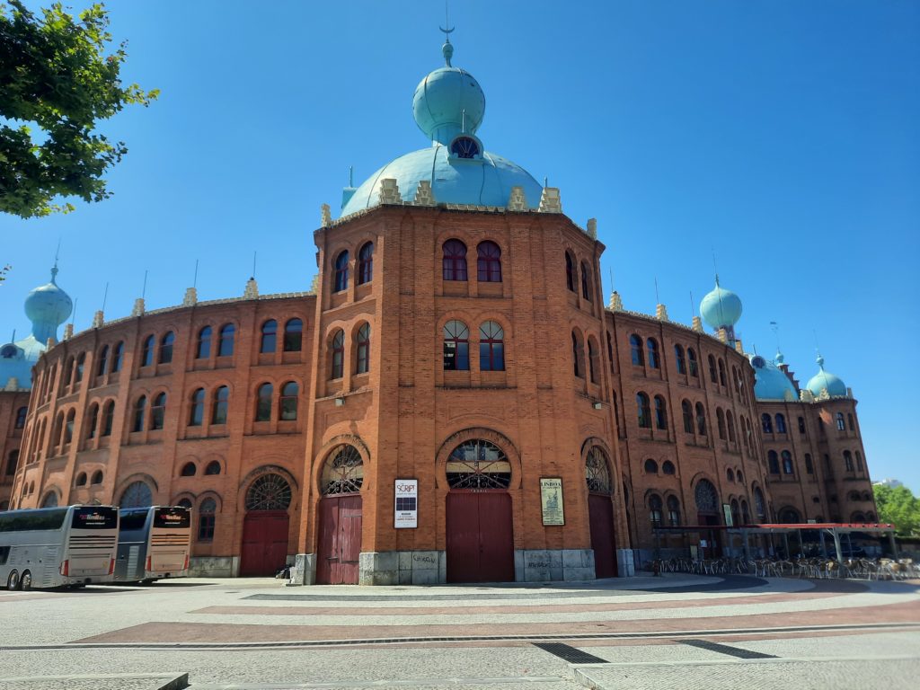a large brick building with a blue dome