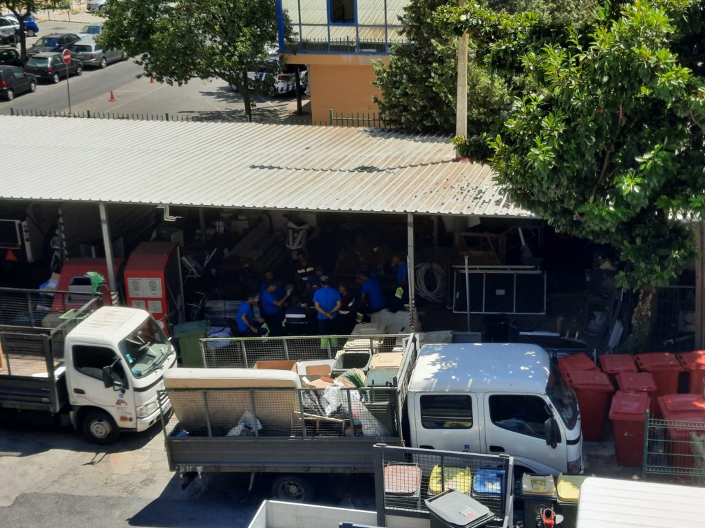 a group of people sitting in a garage