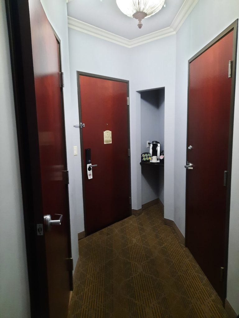a hallway with red doors