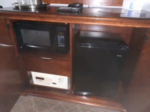 a microwave and dishwasher on a shelf