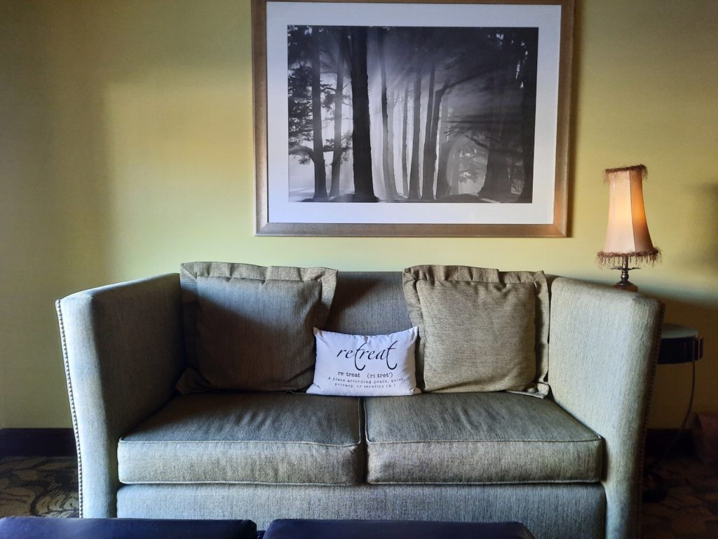 a couch with a picture on the wall