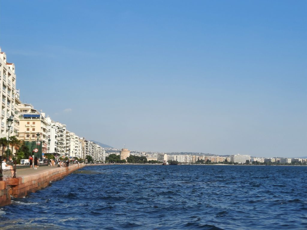 a body of water with buildings and buildings in the background