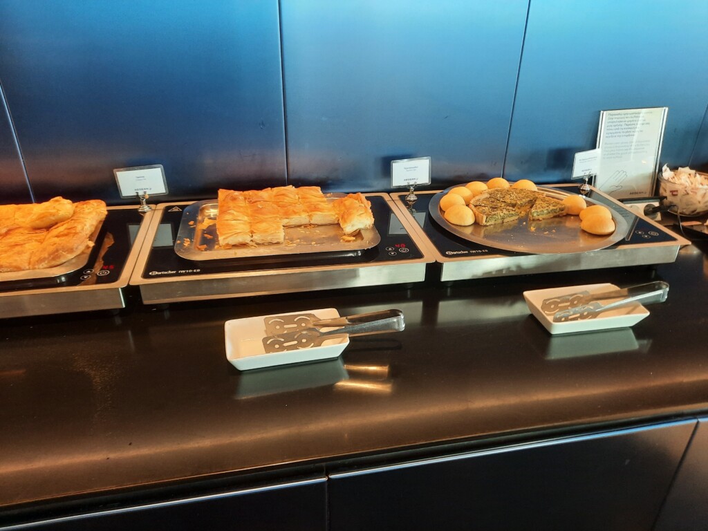 food on a counter with plates of food