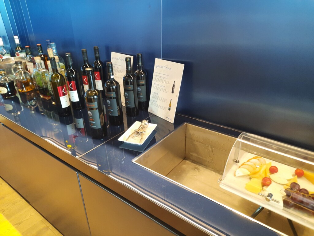 a row of bottles of wine on a counter