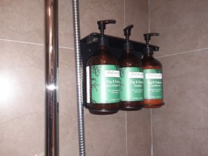 a group of soap dispensers on a wall