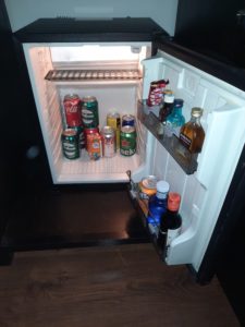 a refrigerator with drinks and beverages