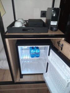 a mini fridge with a drink inside