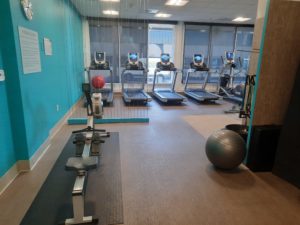 a room with treadmills and exercise equipment