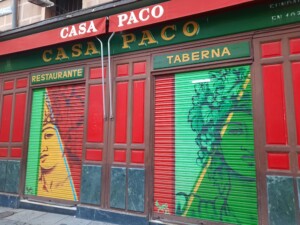 a store front with colorful doors