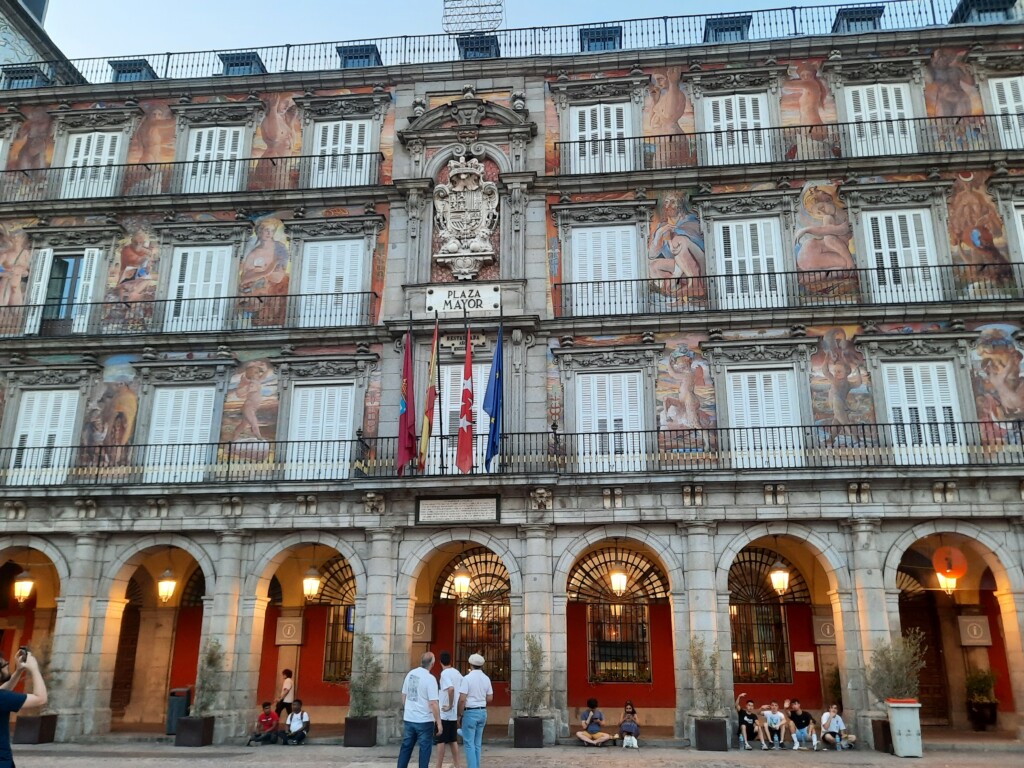 a building with many windows and a mural on the wall