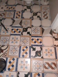 a floor with colorful tiles