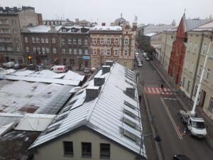 a rooftop of a building with snow on it