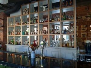 a bar with bottles on shelves