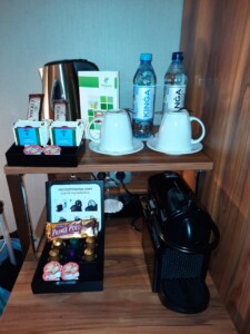 a coffee machine and coffee cups on a table