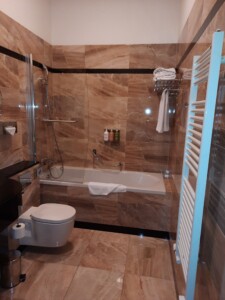 a bathroom with a bathtub and toilet