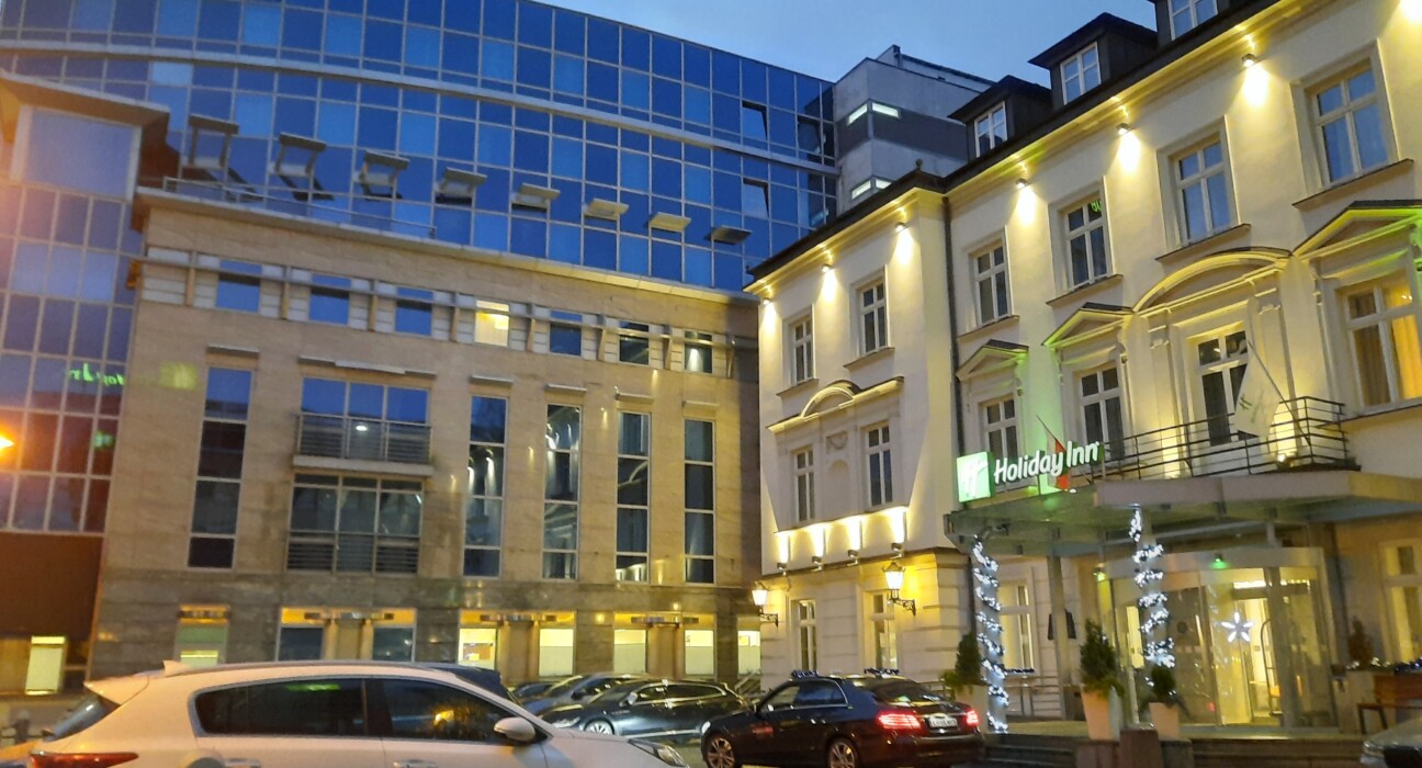 a building with cars parked in front of it