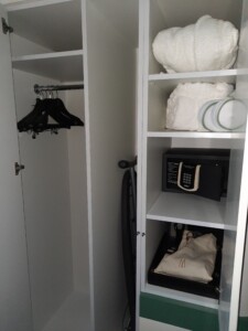 a closet with white shelves