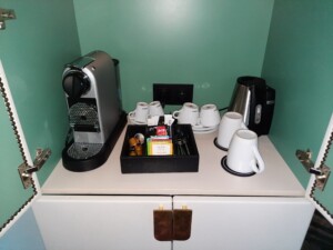 a coffee machine and coffee cups on a counter