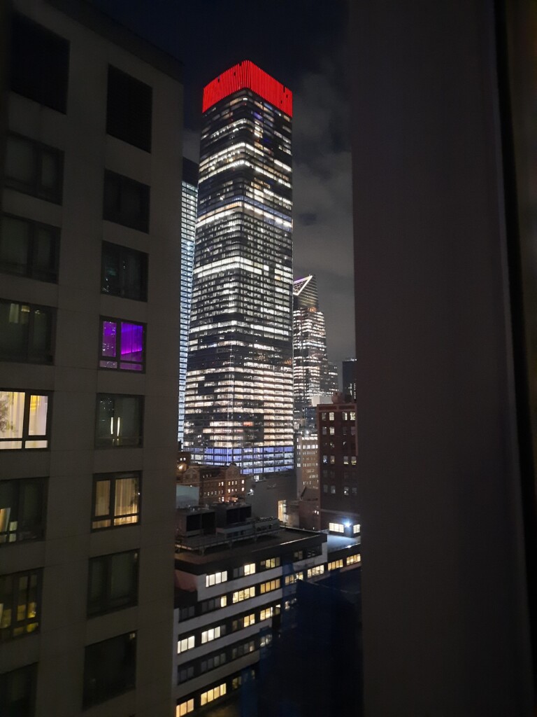 a tall building with a red top