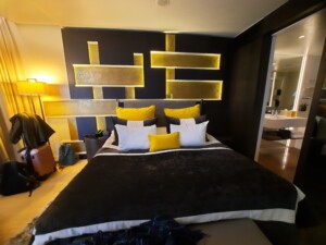 a bed with yellow pillows