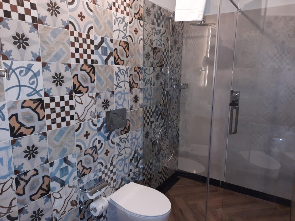 a bathroom with a shower and toilet