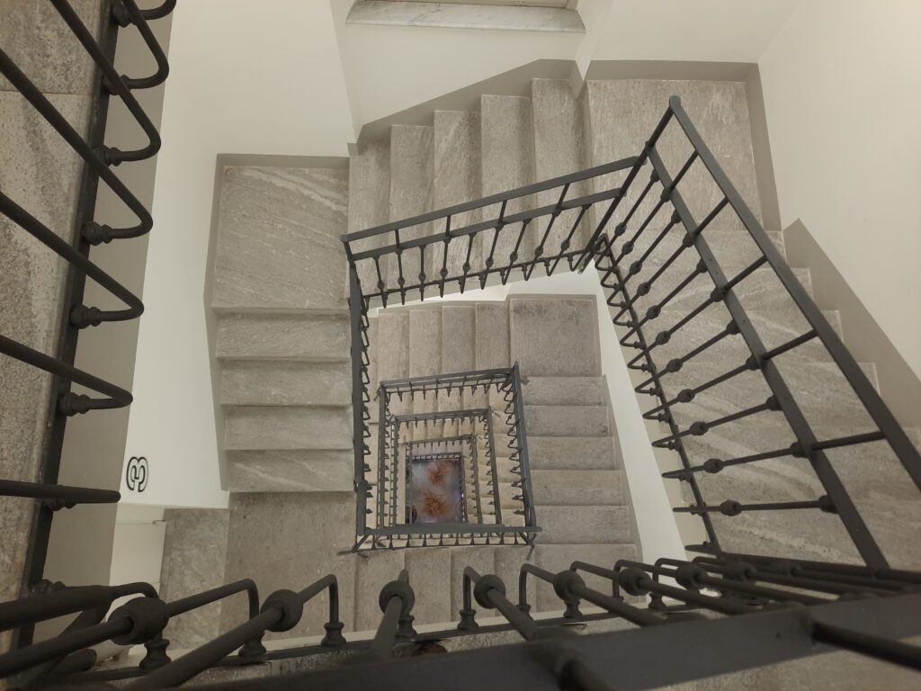 a staircase with metal railings