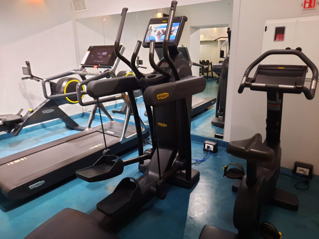 a group of exercise machines in a room