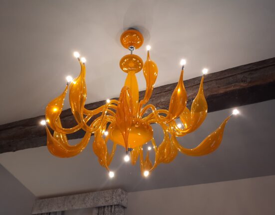 a chandelier with lights from the ceiling