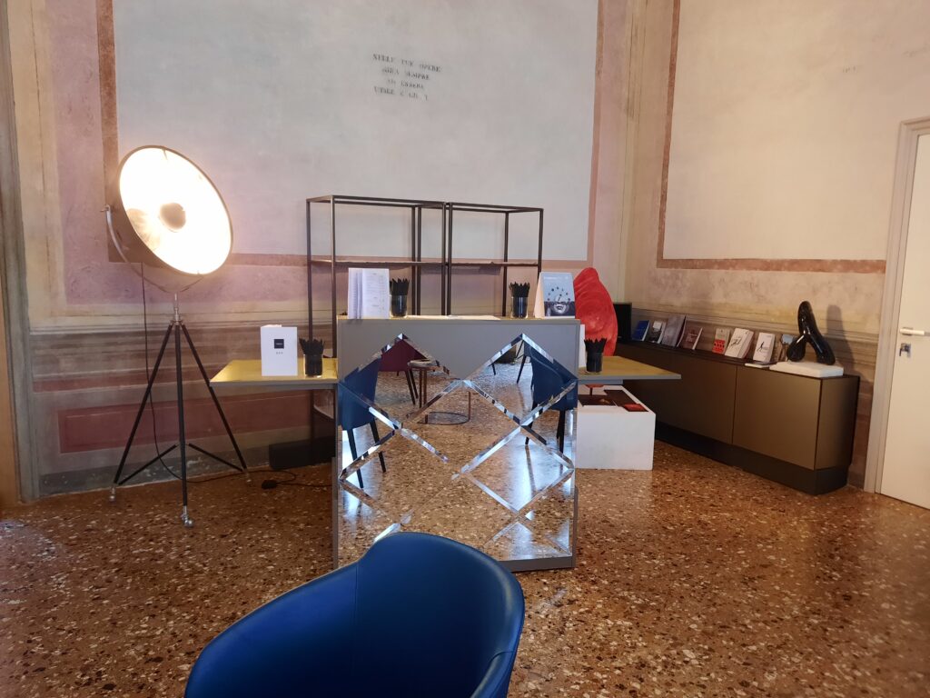 a room with a mirror desk and a blue chair