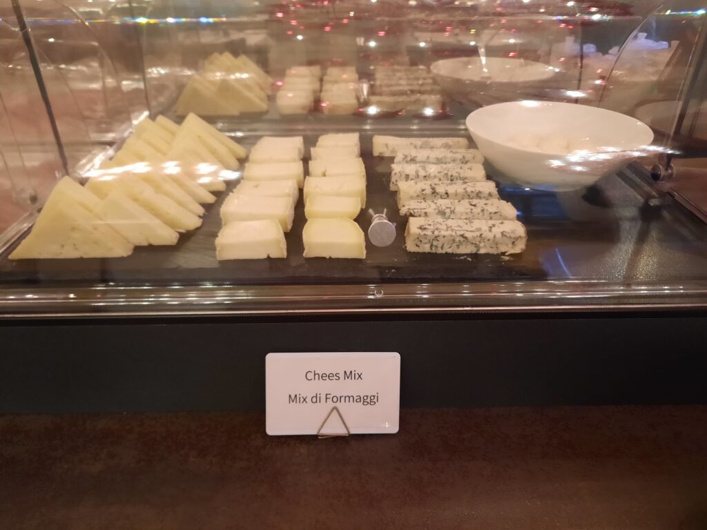 a display case with different types of cheese