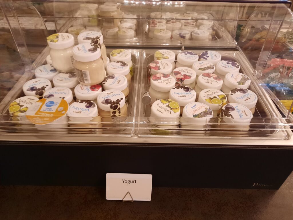 a display case with jars of yogurt