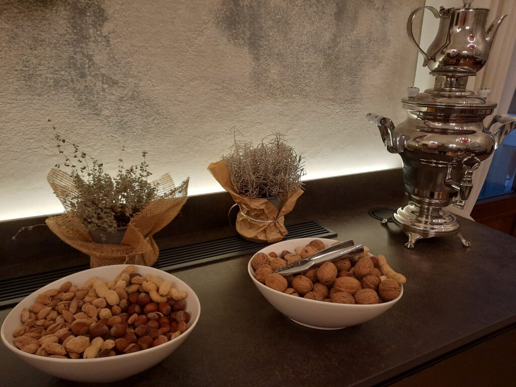 bowls of nuts and peanuts on a counter
