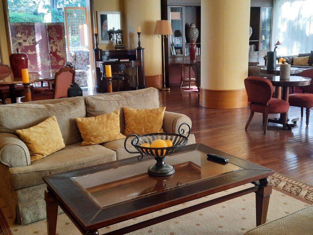 a living room with couches and a glass coffee table