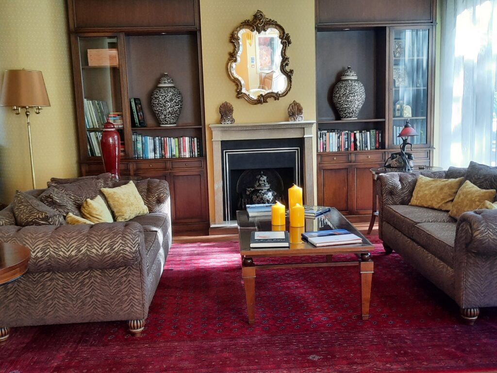 a living room with a fireplace and couches