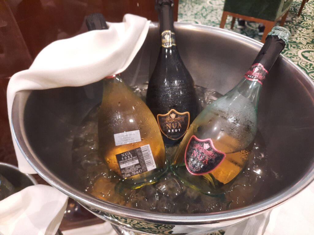 a group of bottles in a bucket of ice