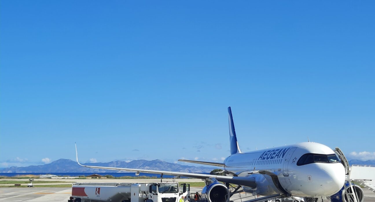a white airplane parked on a tarmac