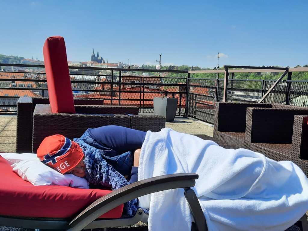 a person sleeping on a chair